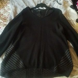 Black sweater with gray design.